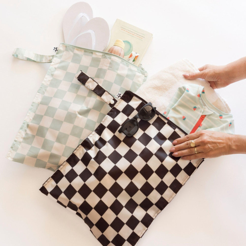 Tiny Twinkle Mess Proof Wet Bag at the pool or beach for wet swimsuit separation