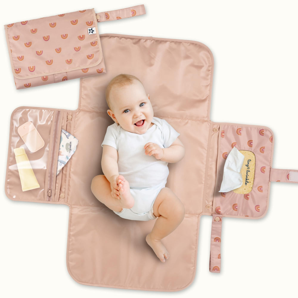 Tiny Twinkle portable changing pad folded flat for compact storage and quick on-the-go changes.