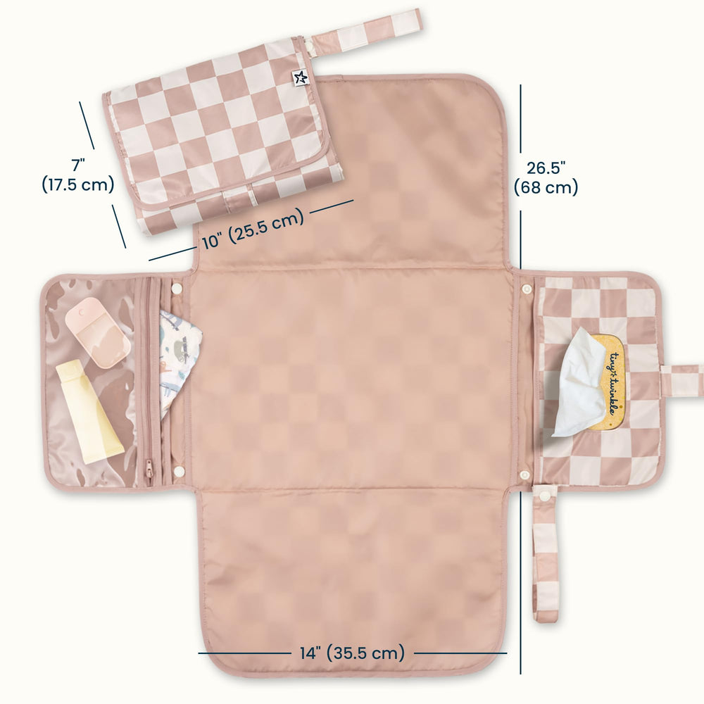 Tiny Twinkle portable changing pad with wipes-pocket enables quick, one-handed diaper changes.