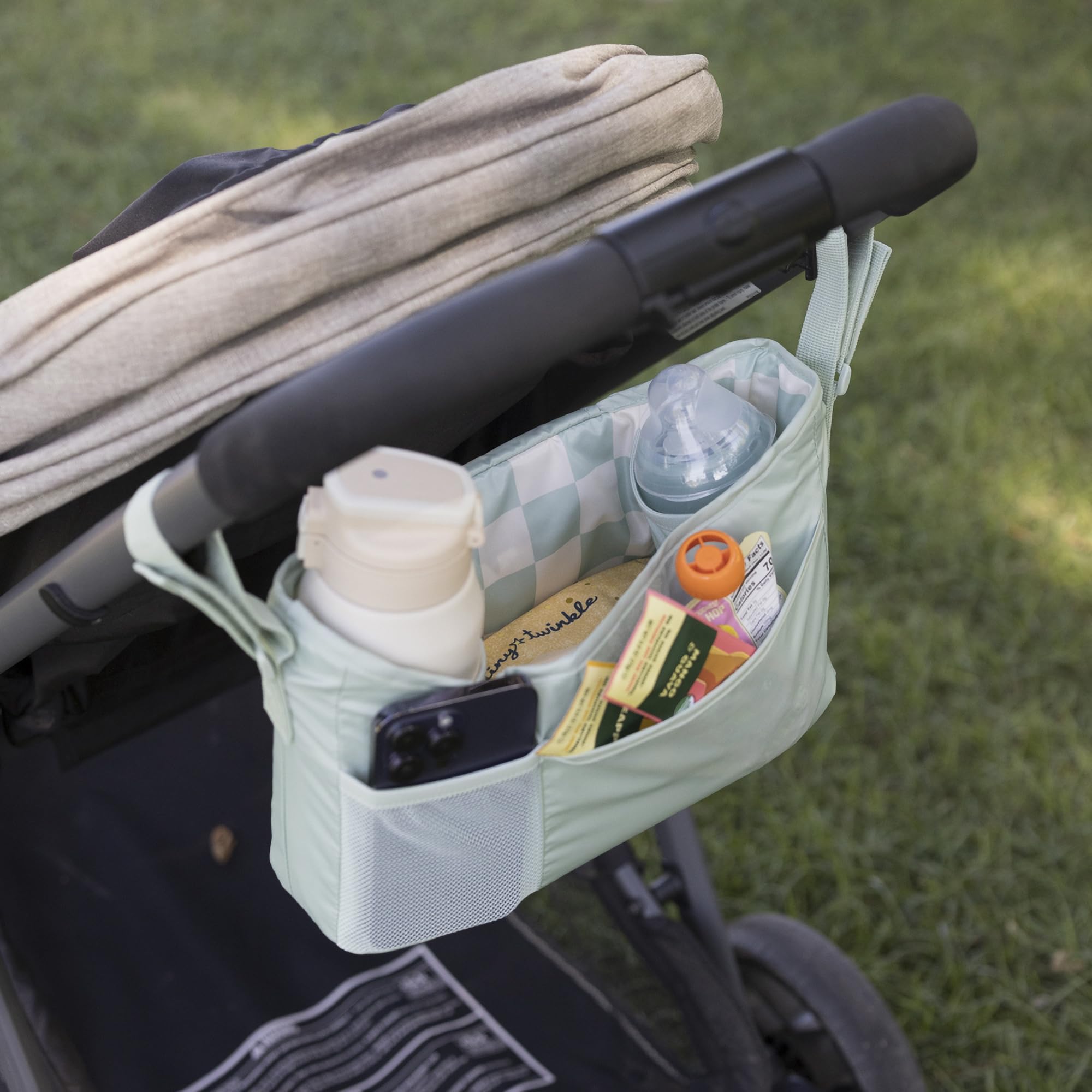 Sage checkers fabric close-up shows durable, water-resistant material.