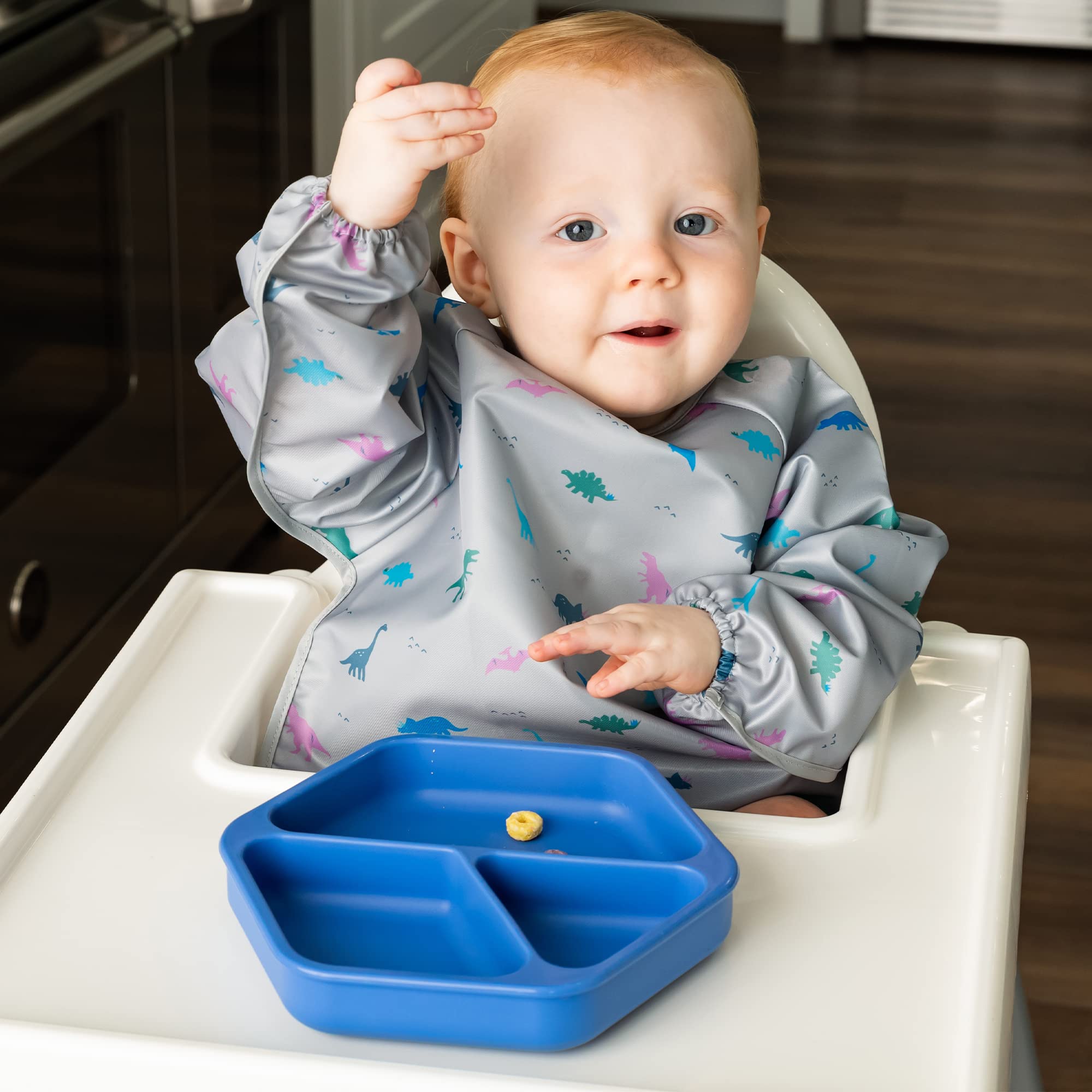 Tiny Twinkle silicone suction base close-up highlighting strong grip on trays for mess-free feeding.