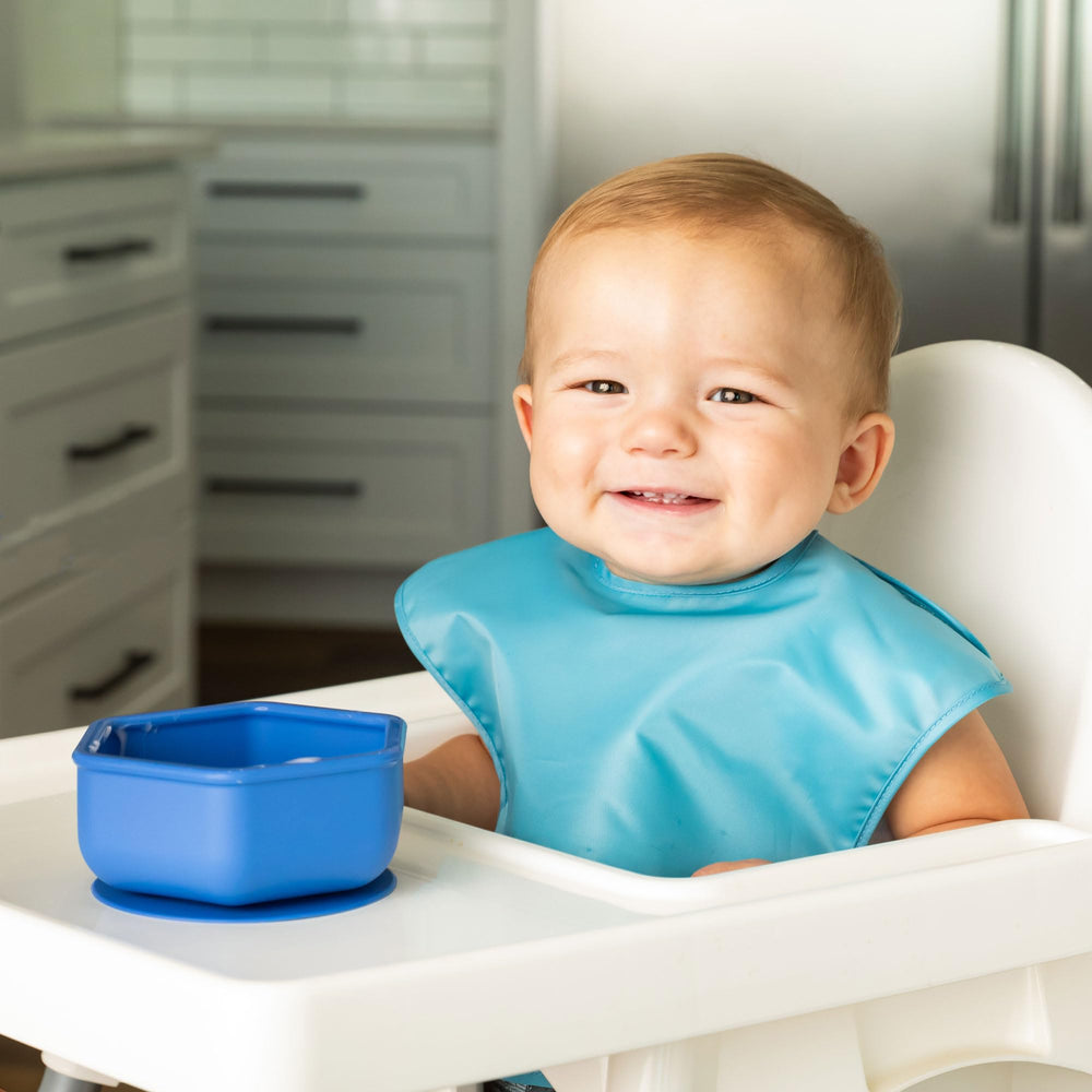 Tiny Twinkle silicone suction bowl indigo with lid demonstrates secure mealtime storage