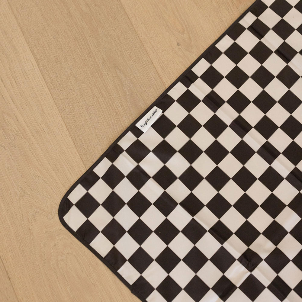 Tiny Twinkle Splat Mat with black checkers design adds playful style.