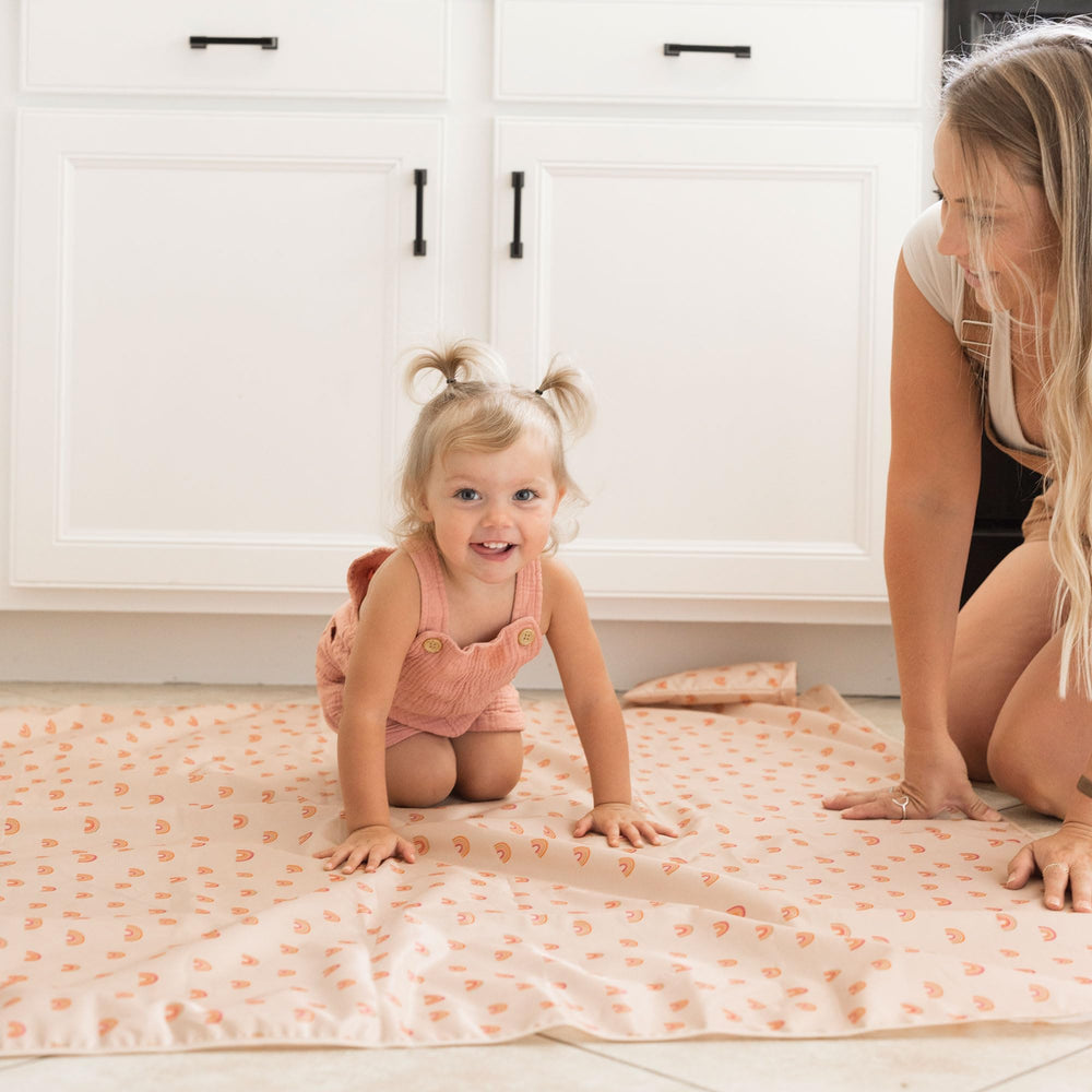 Tiny Twinkle Splat Mat folded compactly for diaper bag storage