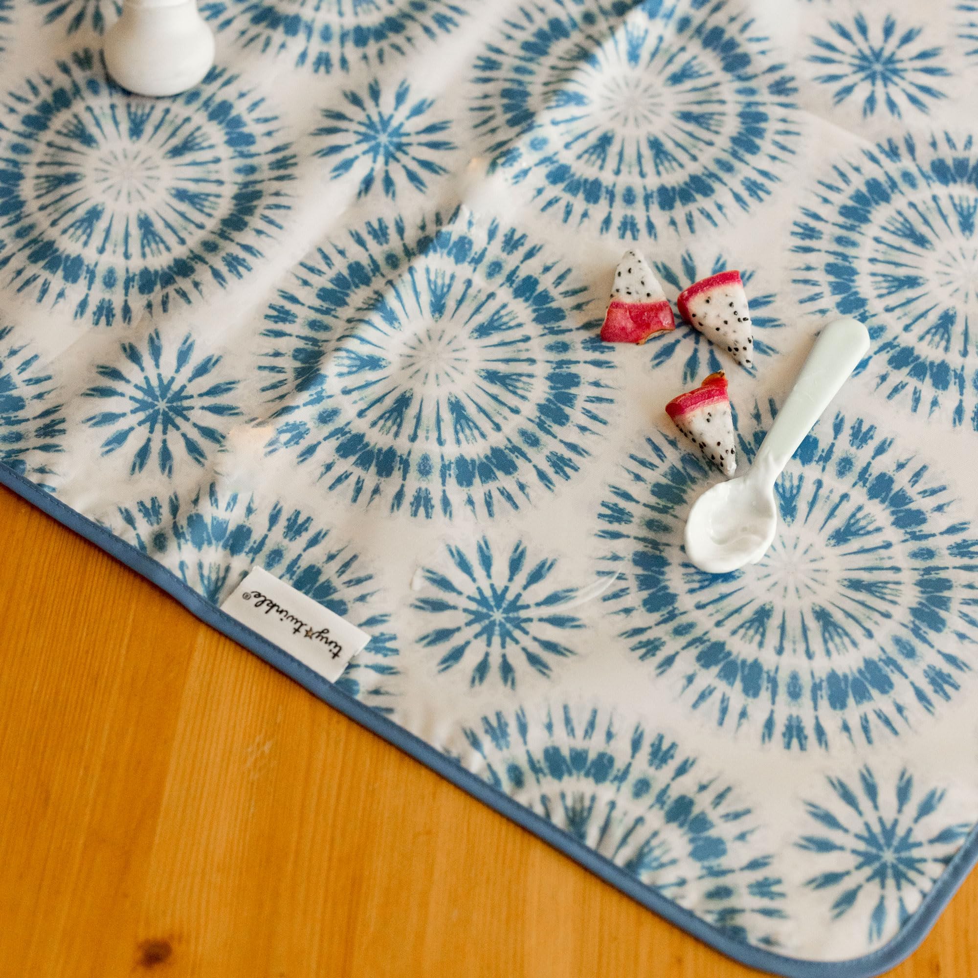 Tiny Twinkle Splat Mat folded compactly for travel.