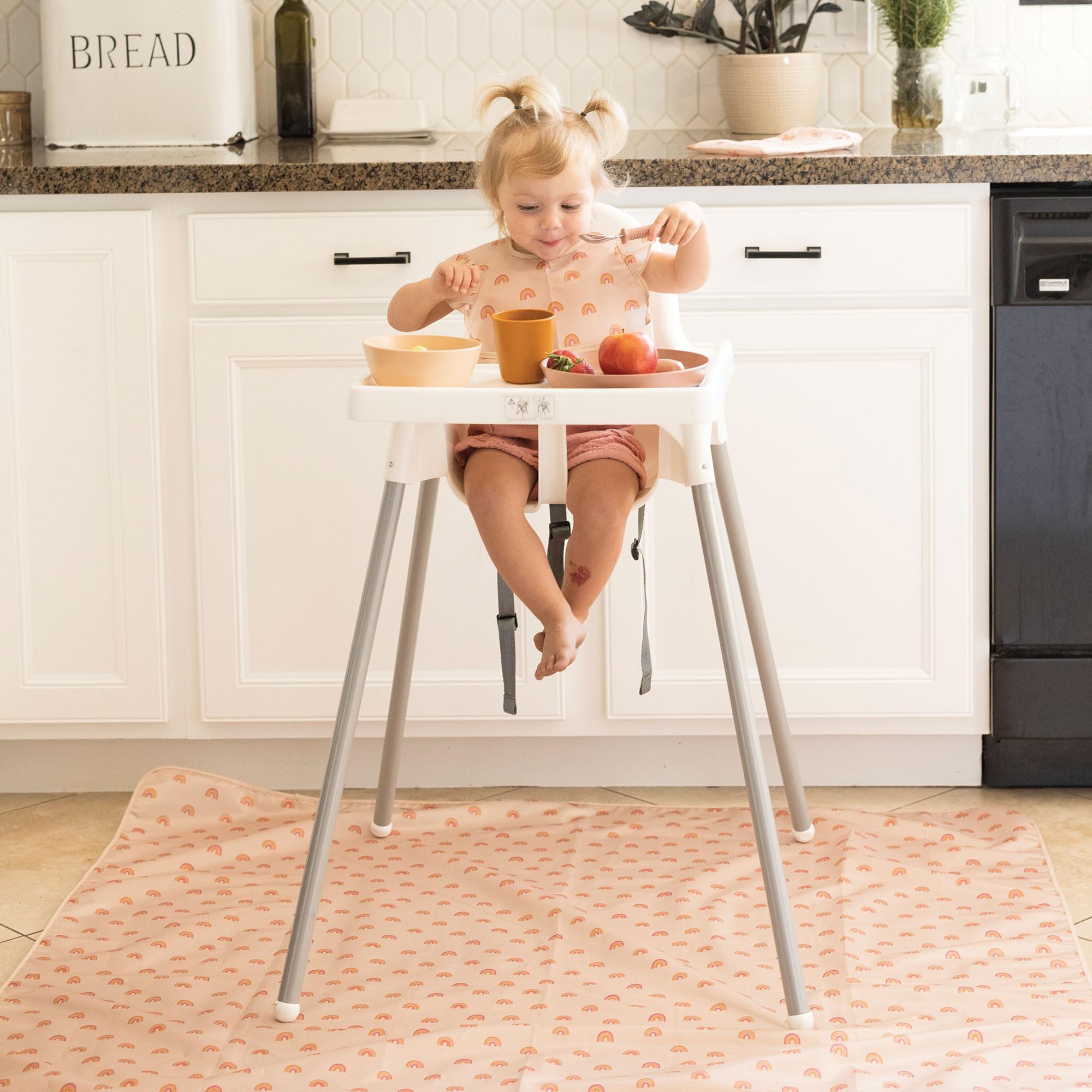 Tiny Twinkle Splat Mat mealtime surface on a baby table for easy cleanup