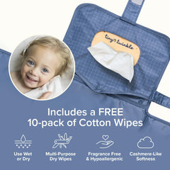 Tiny Twinkle changing pad clipped to a stroller for hands-free transport