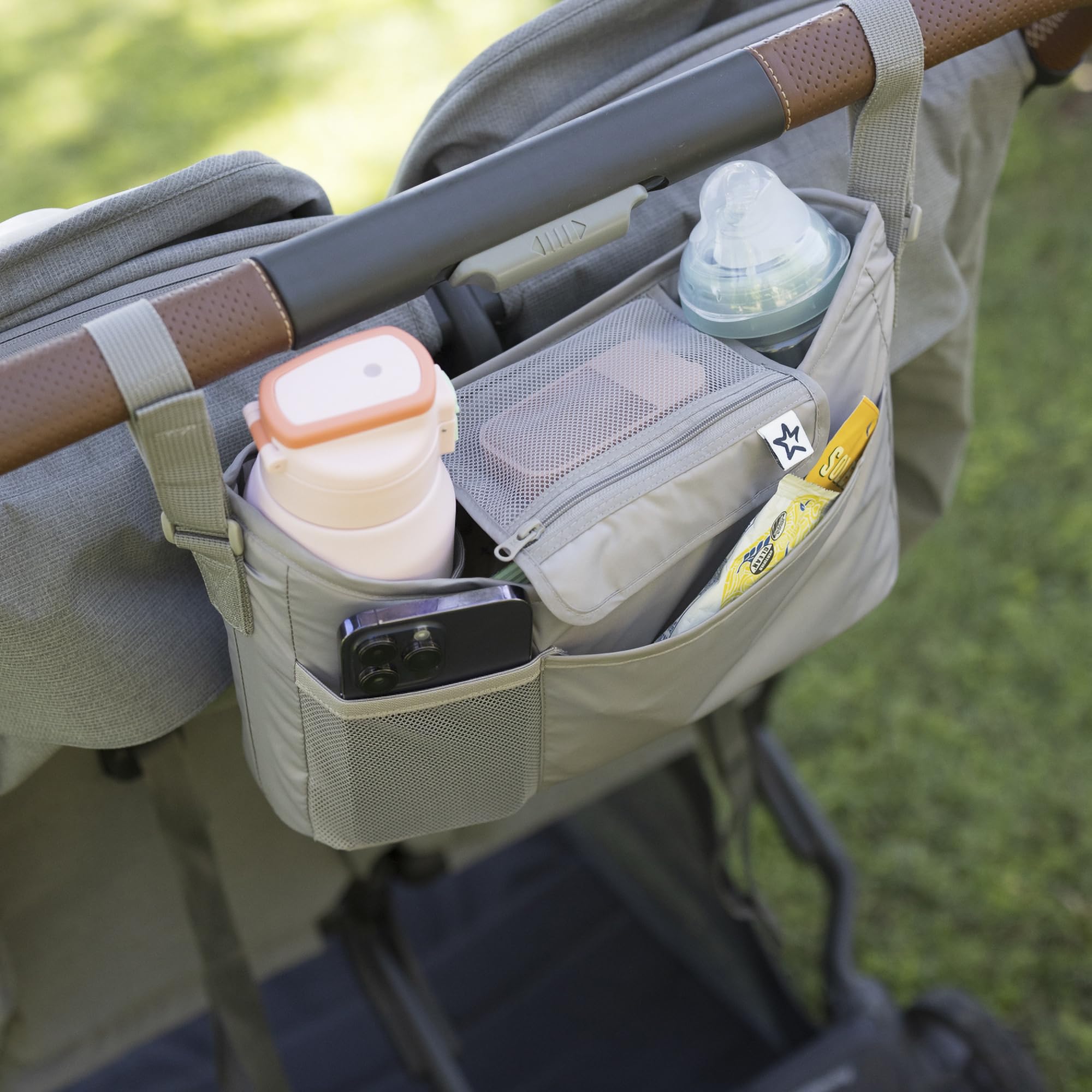 Tiny Twinkle bottle slot demonstrates large-capacity storage for bottles or tumblers.