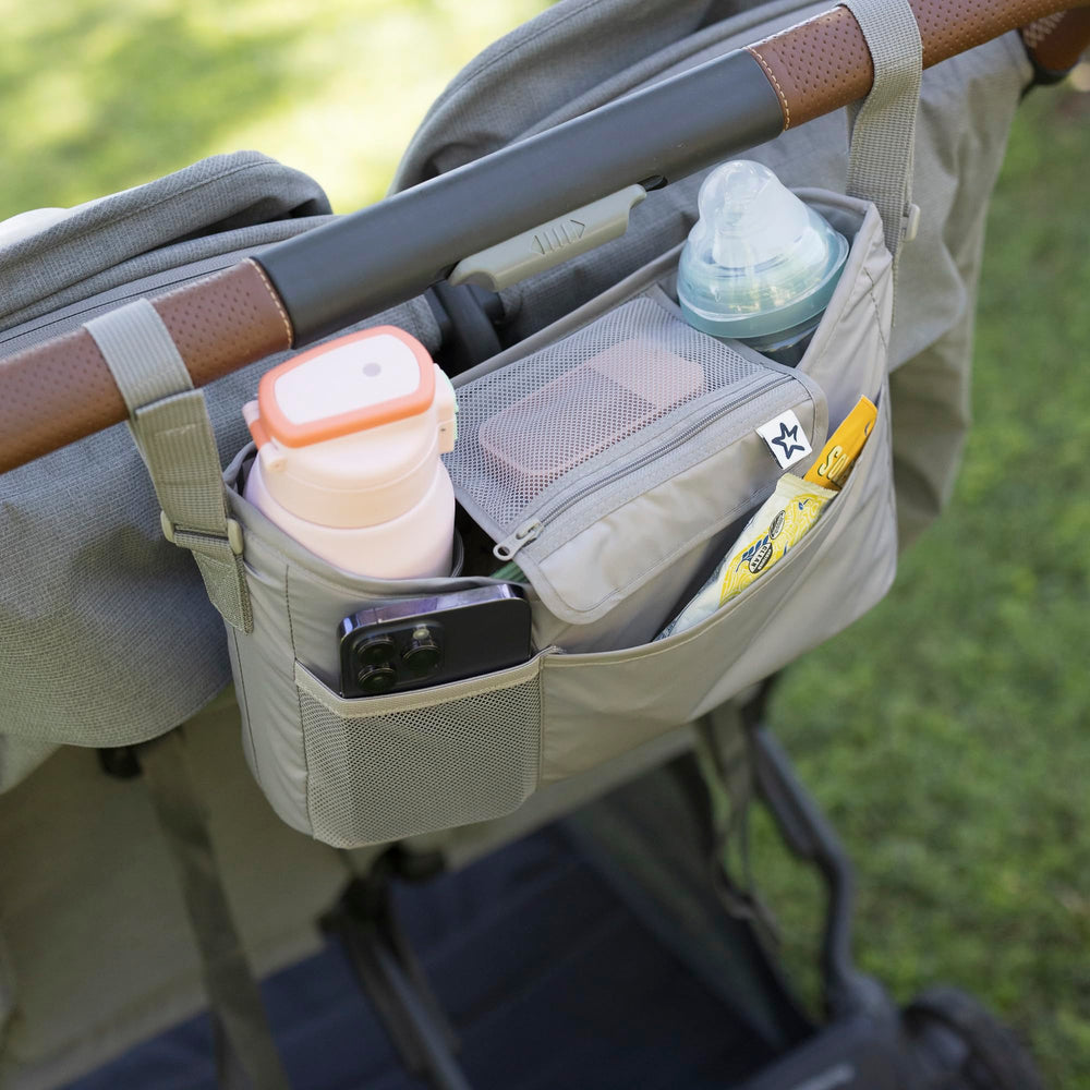 Tiny Twinkle bottle slot demonstrates large-capacity storage for bottles or tumblers.