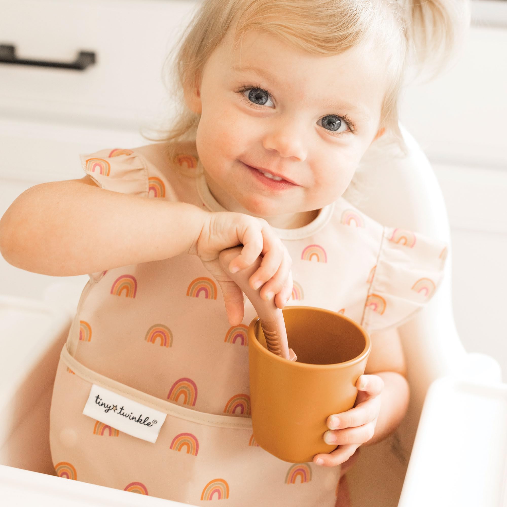 Tiny Twinkle waterproof bib showing wipe-clean fabric for quick cleanup.