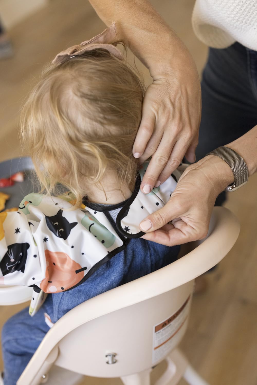 Tiny Twinkle waterproof smock back coverage illustrates full-body protection during feeding