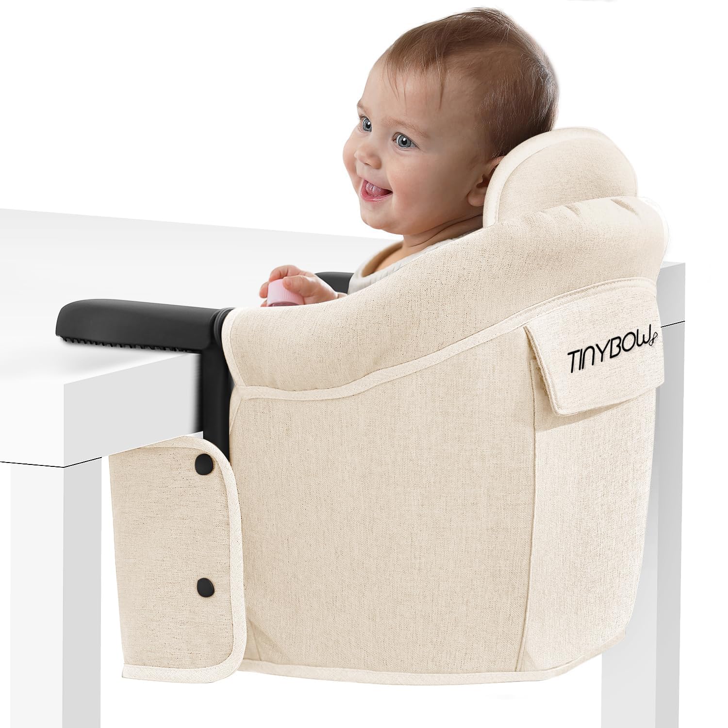 Tinybow Hook On High Chair attached to a table with sturdy clamps for secure seating.