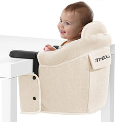 Tinybow Hook On High Chair attached to a table with sturdy clamps for secure seating.