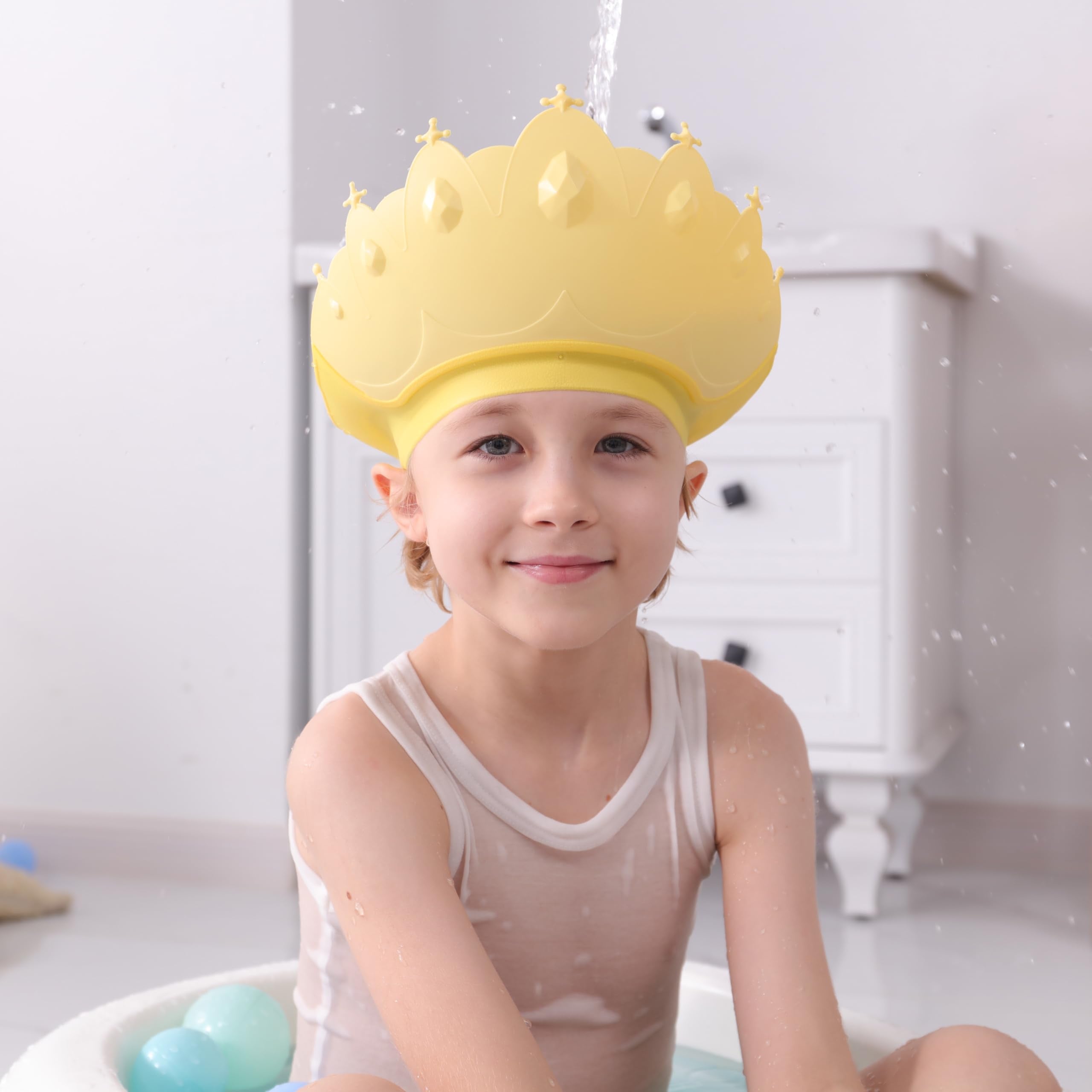 TinyGuardian baby shower cap yellow versatile-use image suggesting sun shading or haircuts
