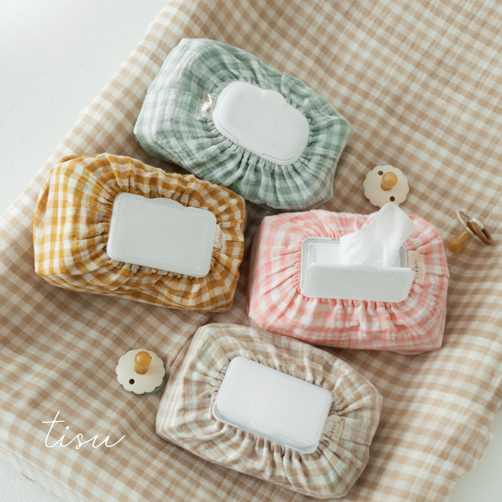 TISU Gingham check-pattern decor adds nursery style to changing area.