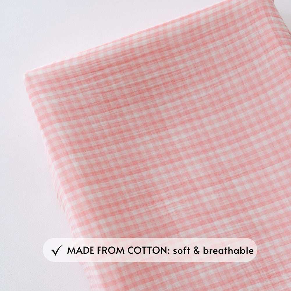 TISU Gingham pink-gingham cover with elastic bands for secure pad fit.