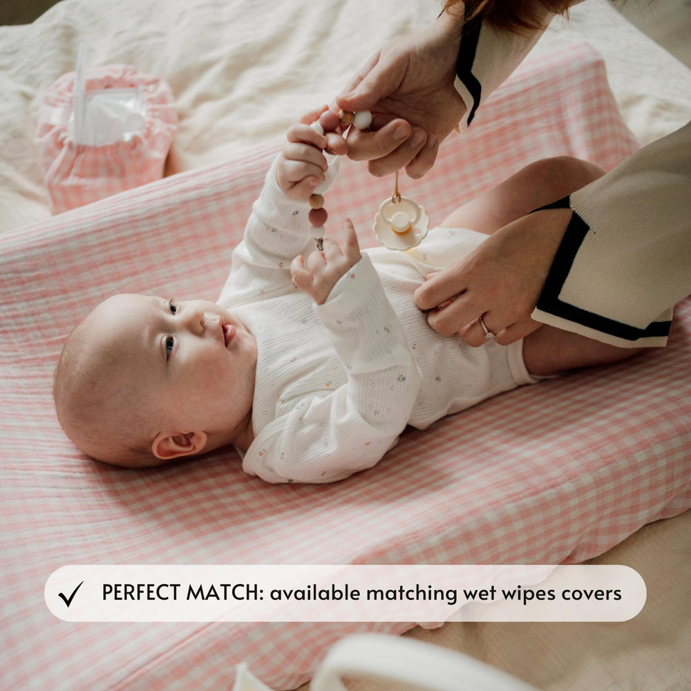 TISU Gingham soft-muslin-fabric cover provides breathable warmth for diaper changes.