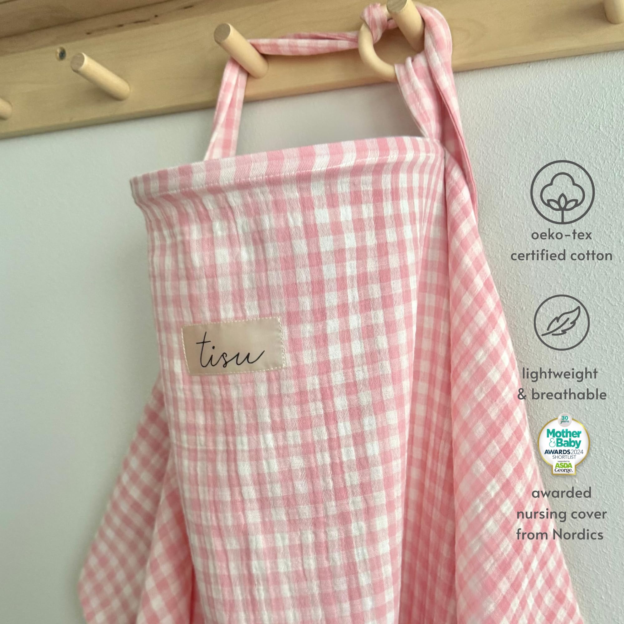 TISU nursing cover providing baby shade against sun and wind outdoors.