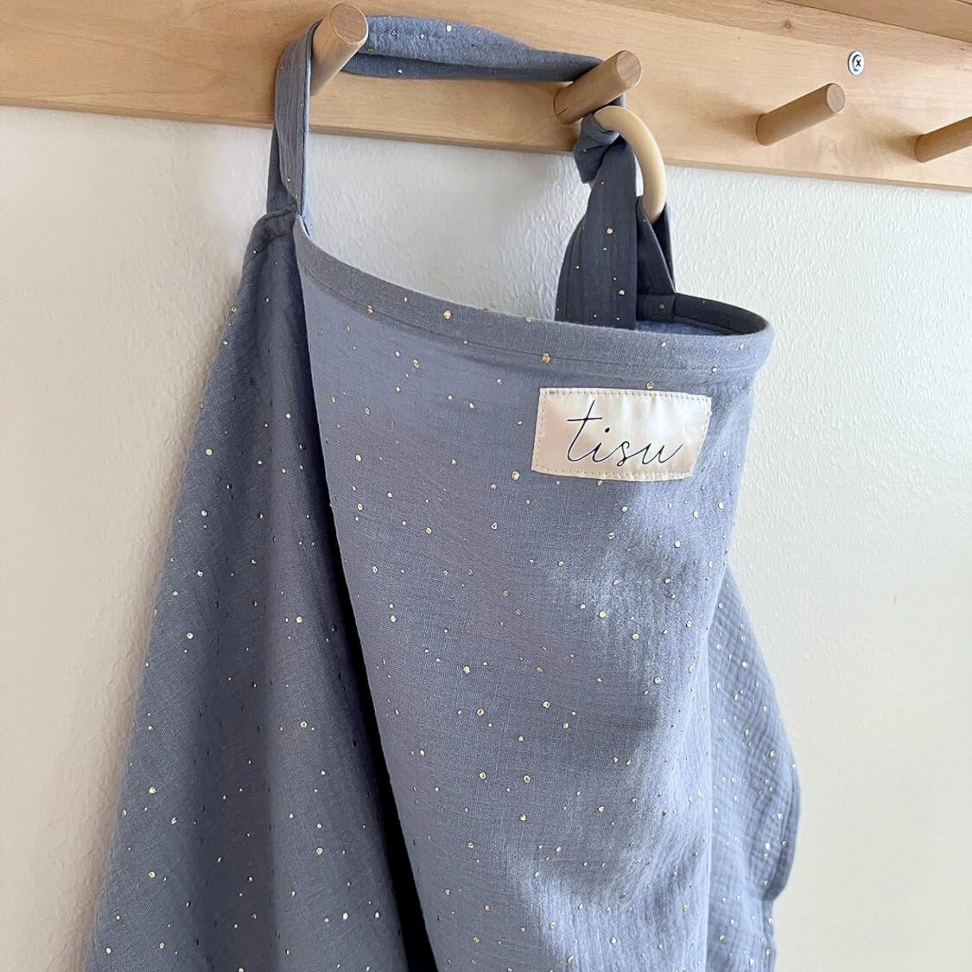TISU nursing cover in light blue with arch neck design enabling eye contact and breathable airflow.