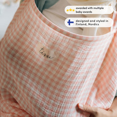 TISU nursing cover demonstrating private feeding solution in public.