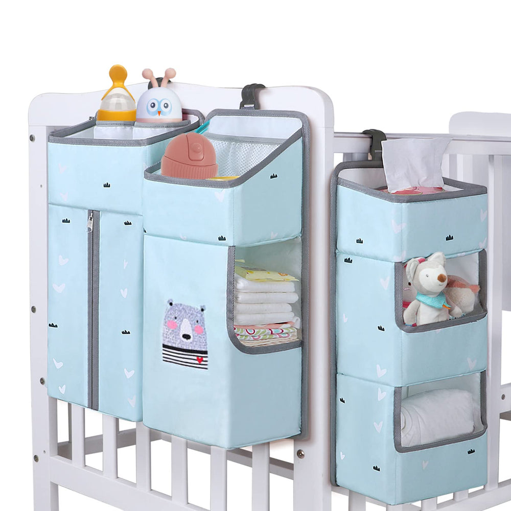 TOCKONIMN hanging diaper caddy sky blue by crib for quick diaper access.