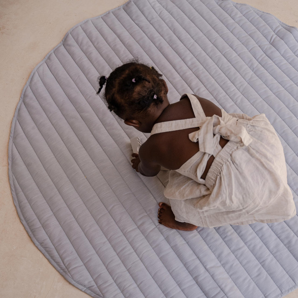 Toddlekind Indoor-outdoor use: lightweight mat doubles as a portable comfort blanket.