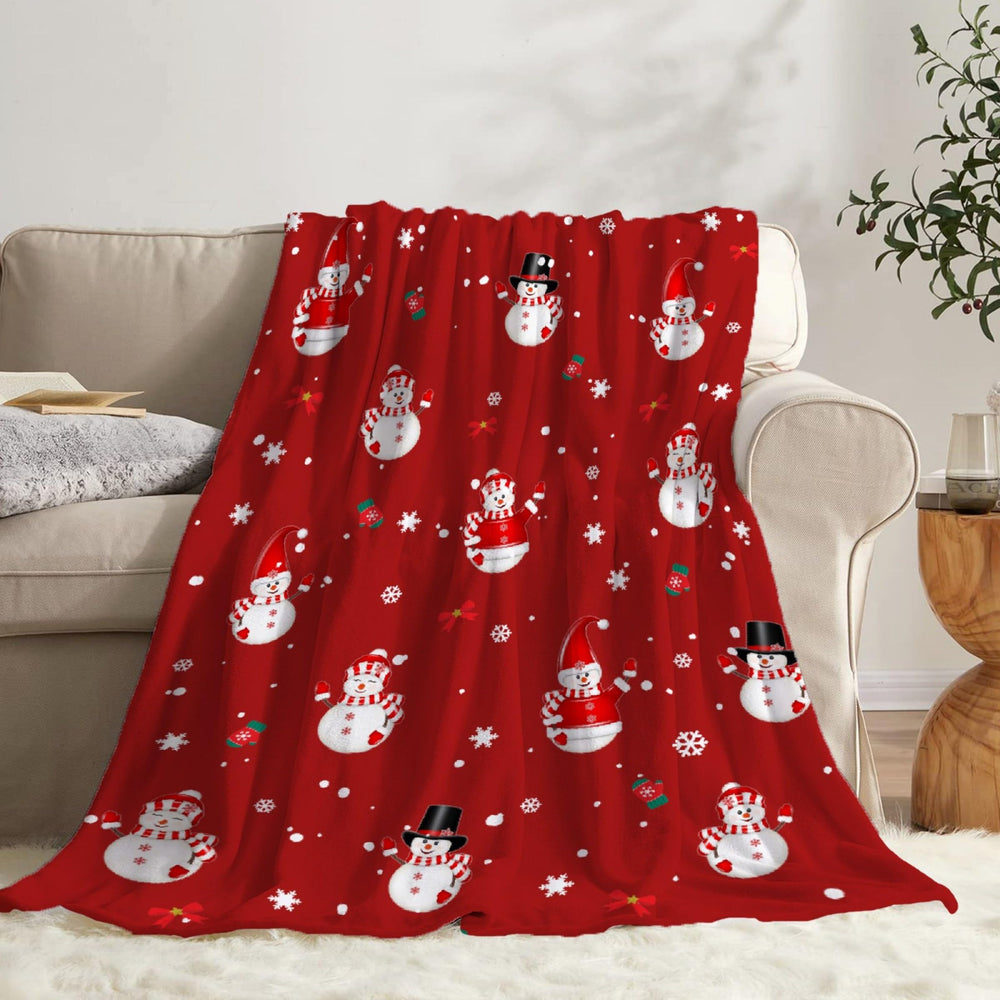Todeyya Christmas Snowman blanket displayed in living room with warm lighting.