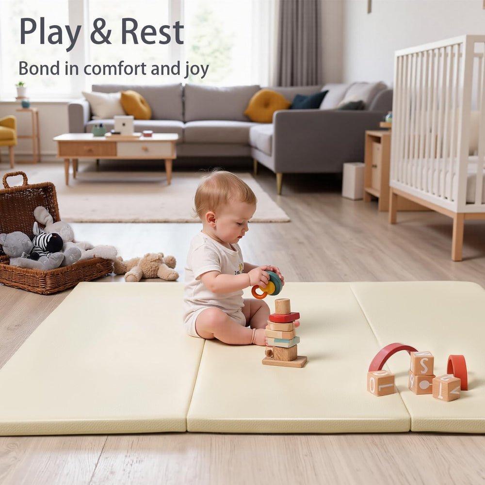TODIBY beige mat supports tummy time and early mobility on the floor.