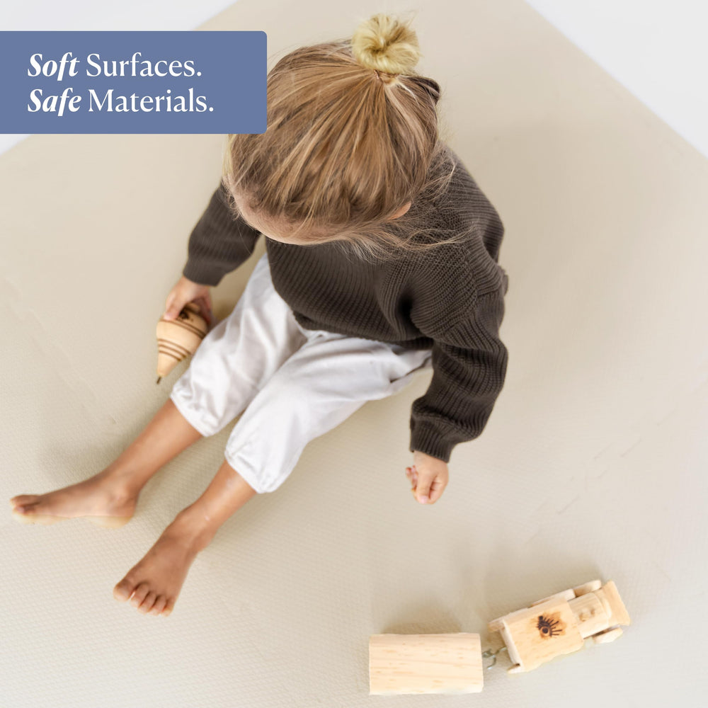 Toddlekind tummy-time scene highlighting supportive foam for early crawling sessions.