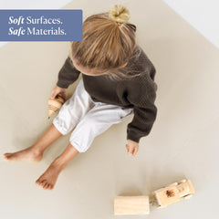 Toddlekind tummy-time scene highlighting supportive foam for early crawling sessions.
