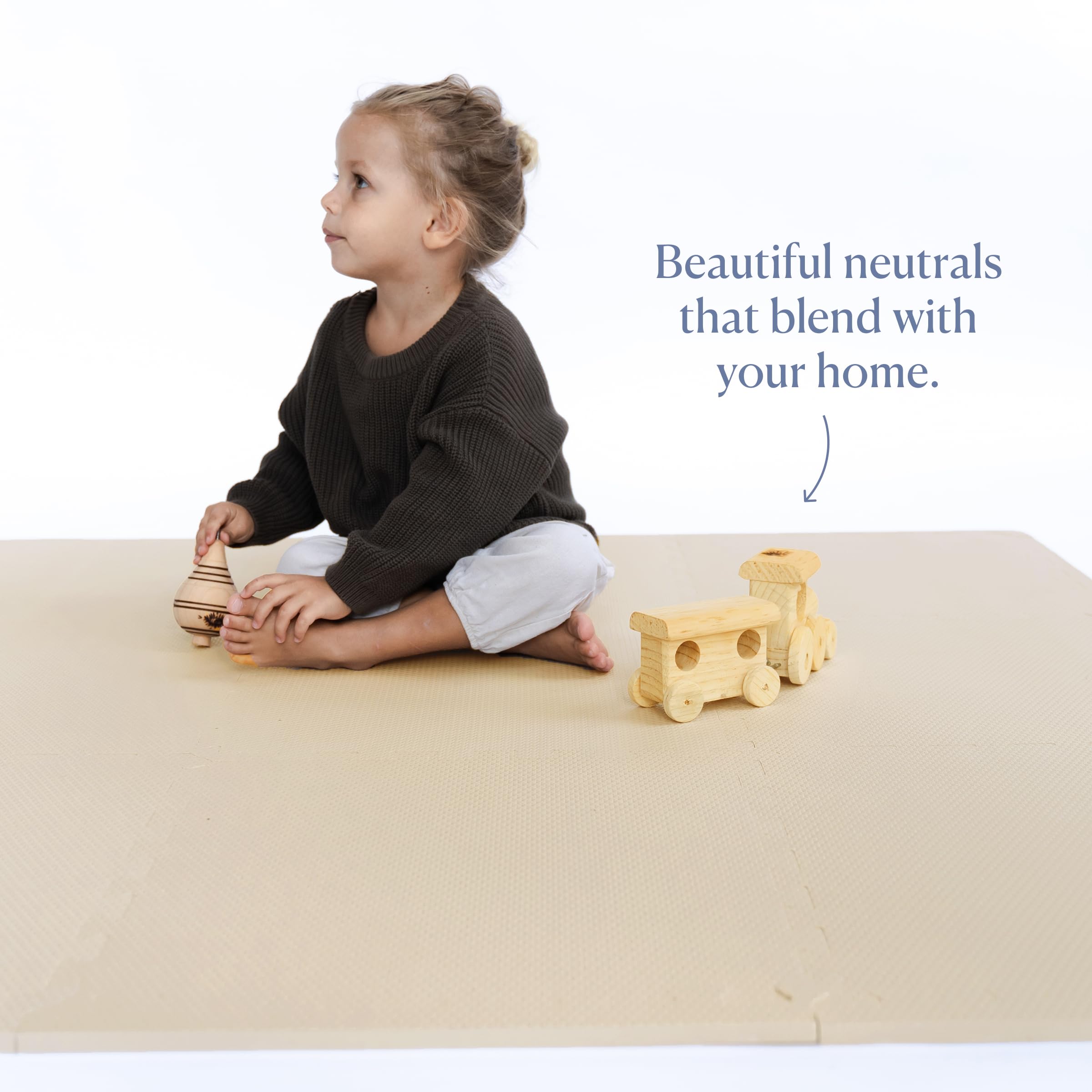 Toddlekind mat being wiped clean with a damp cloth for easy maintenance.