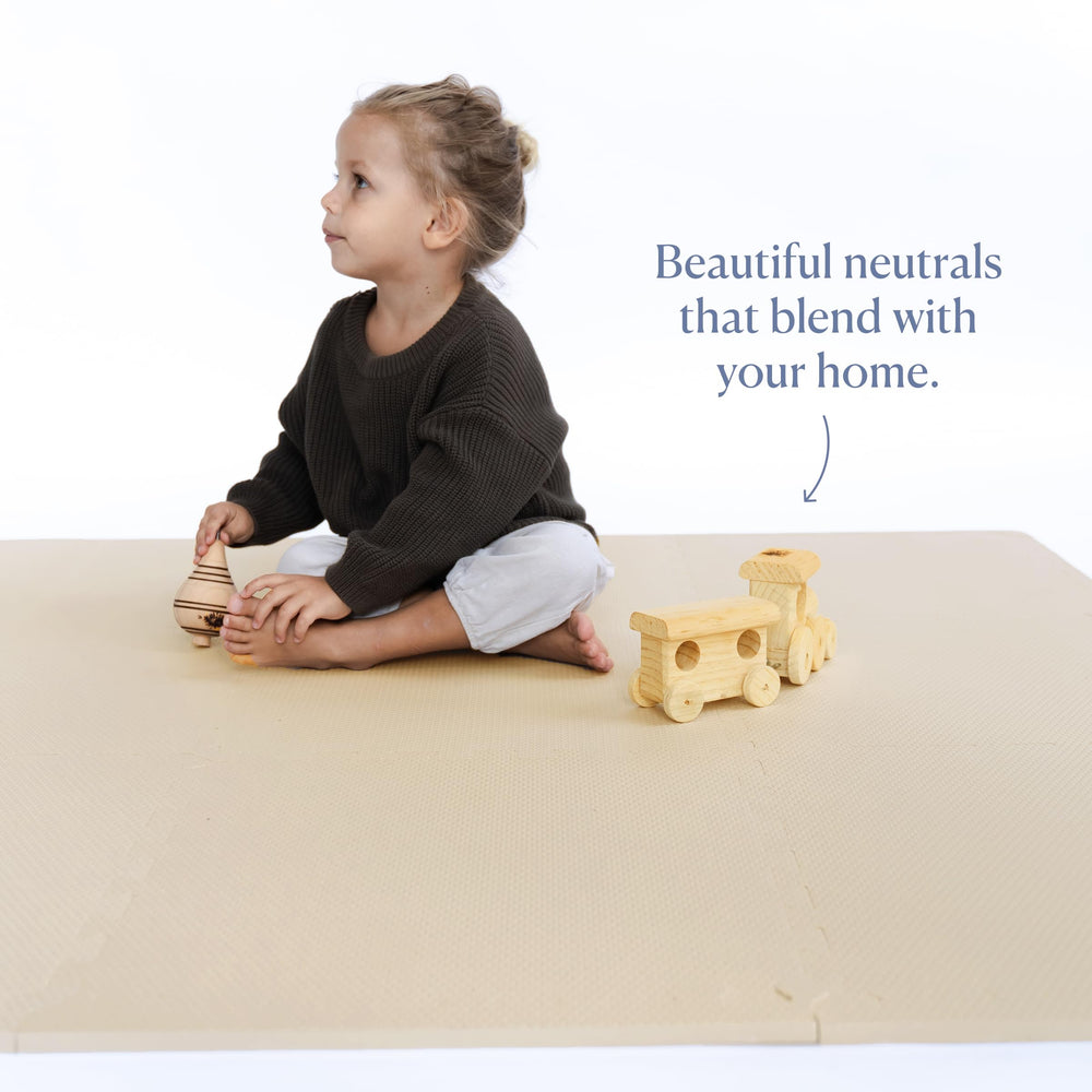 Toddlekind mat being wiped clean with a damp cloth for easy maintenance.