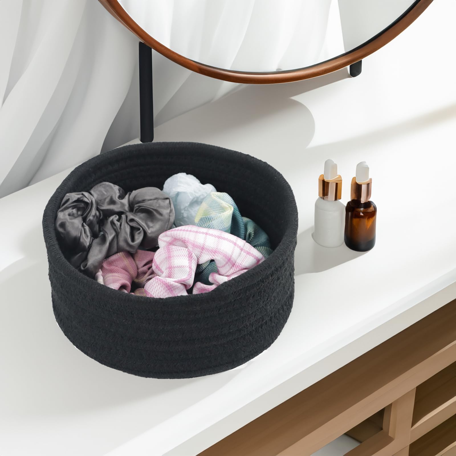 Togous black boho round basket on shelf enhancing warm decor and organization.