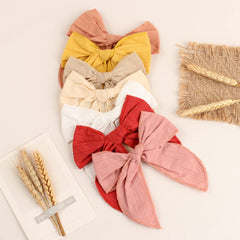 TOKUFAGU large cotton hair bows closeup showing soft fabric and secure clip.