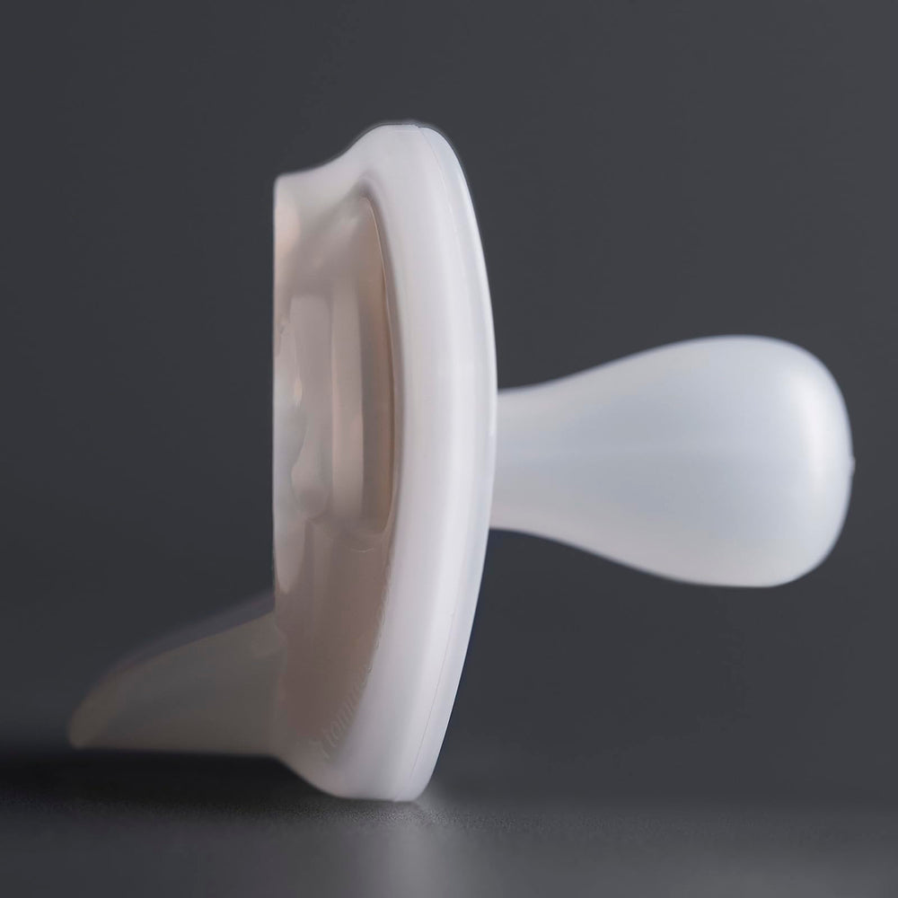 Tommee Tippee Ultra-Light Pacifier color options—clear blue yellow for baby-friendly styling.