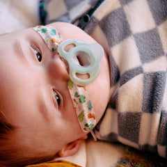 Tommee Tippee Ultra-Light Pacifier mouth close-up highlights lightweight comfort for baby.