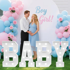 Tongjoy baby marquee letters illuminate the baby shower backdrop with a warm glow.