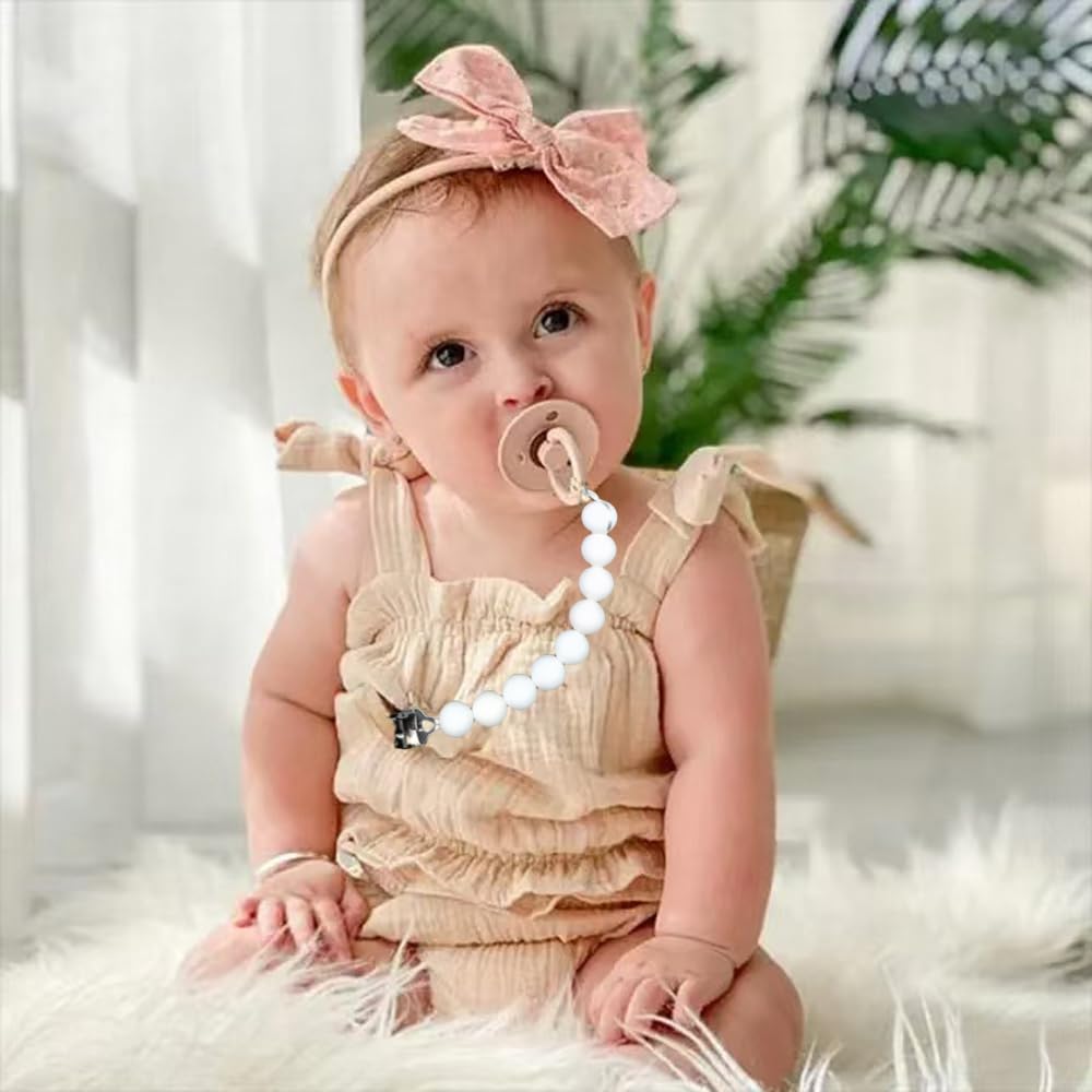 TopGOMES pacifier clip close-up shows durable silicone and stainless steel for everyday use