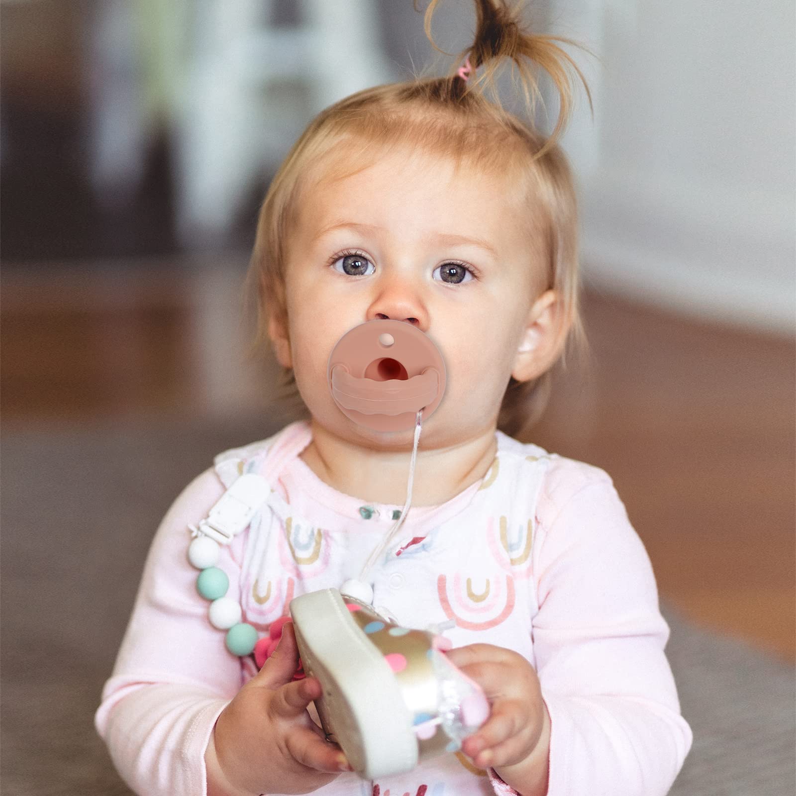 TopGOMES Soother Pacifier handle doubles as baby teething toy.