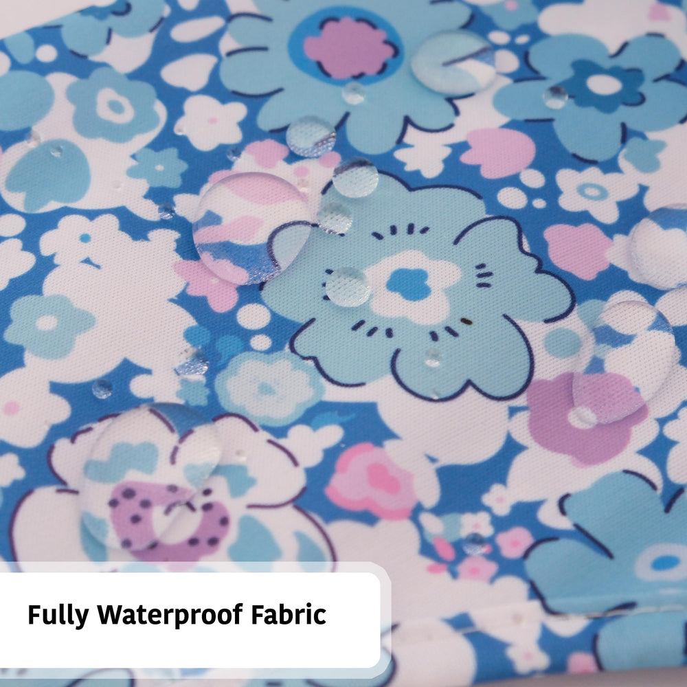 Torange baby smock bib with elastic cuffs and tug-proof Velcro.