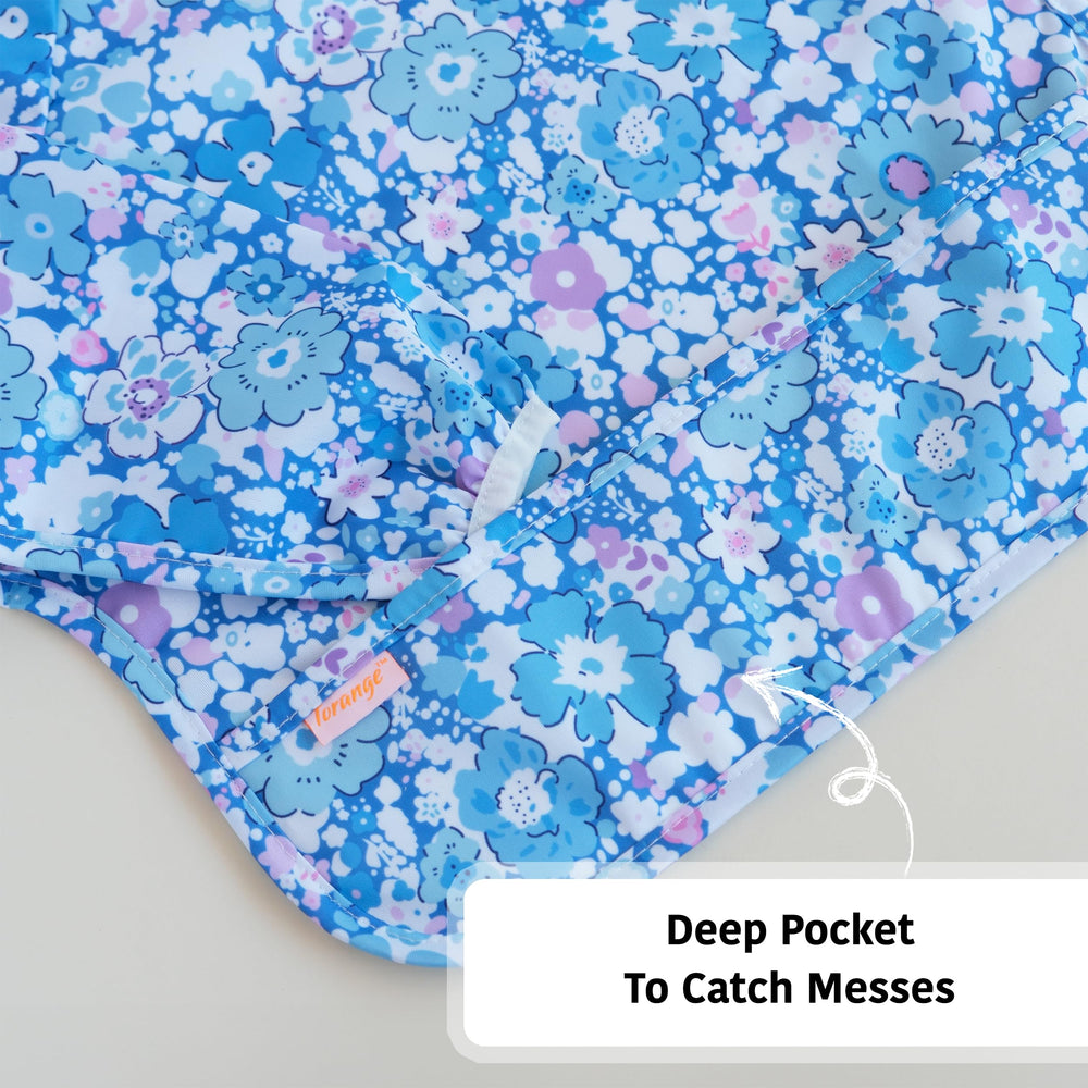 Torange baby smock bib featuring built-in food catcher pocket.