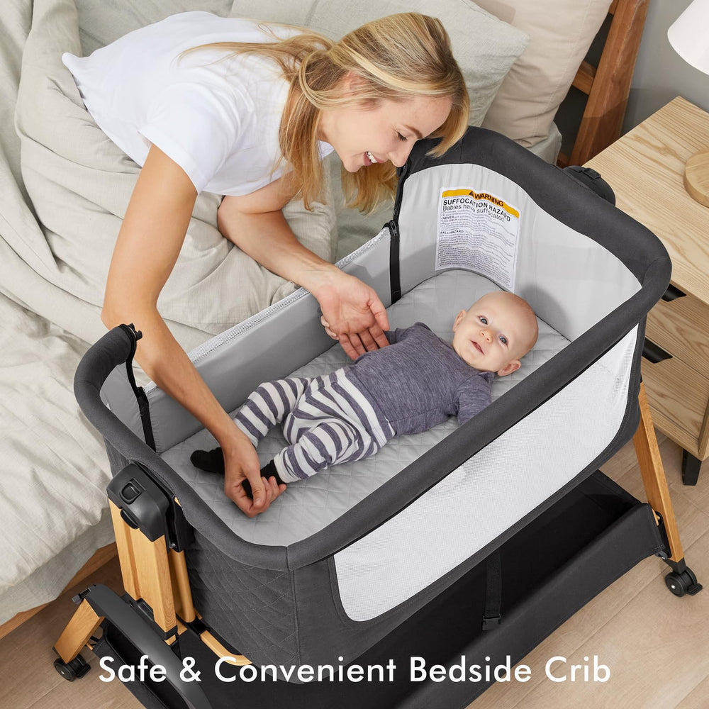 TotRun bassinet bedside sleeper black rocking action demonstrating gentle sway for soothing newborn.