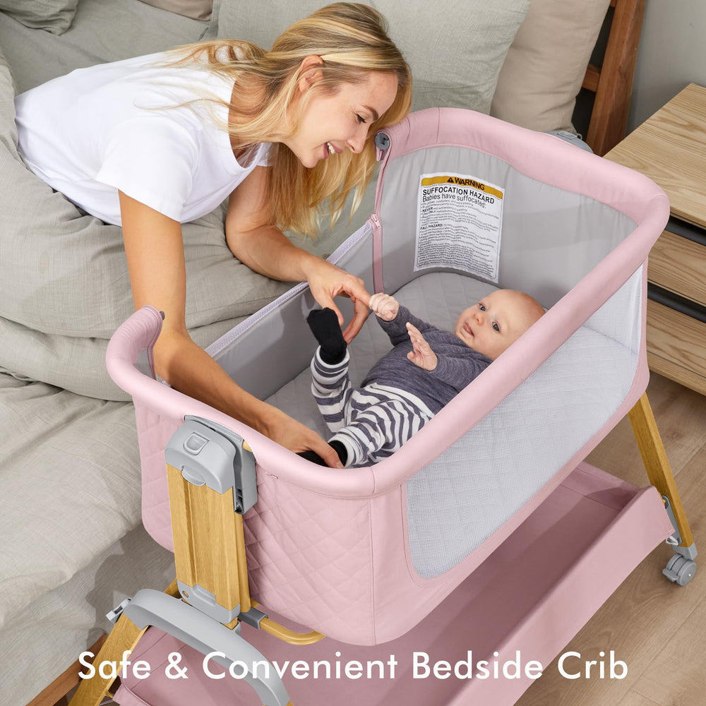 TotRun bassinet bedside sleeper pink attached to bed demonstrates convenient nighttime access