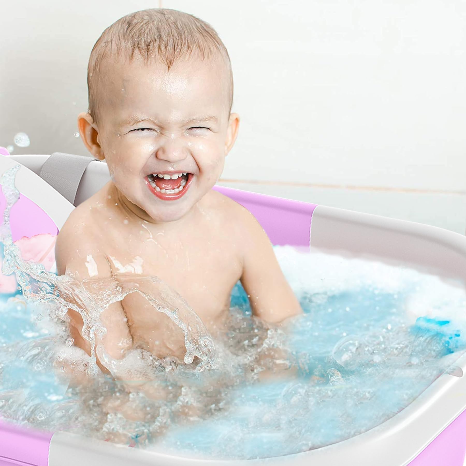 TPN lavender tub in use shows gentle bathing setup for newborns to toddlers.