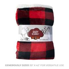 TrailCrest baby blanket with reversible plaid laid on a swaddled infant for comfort.