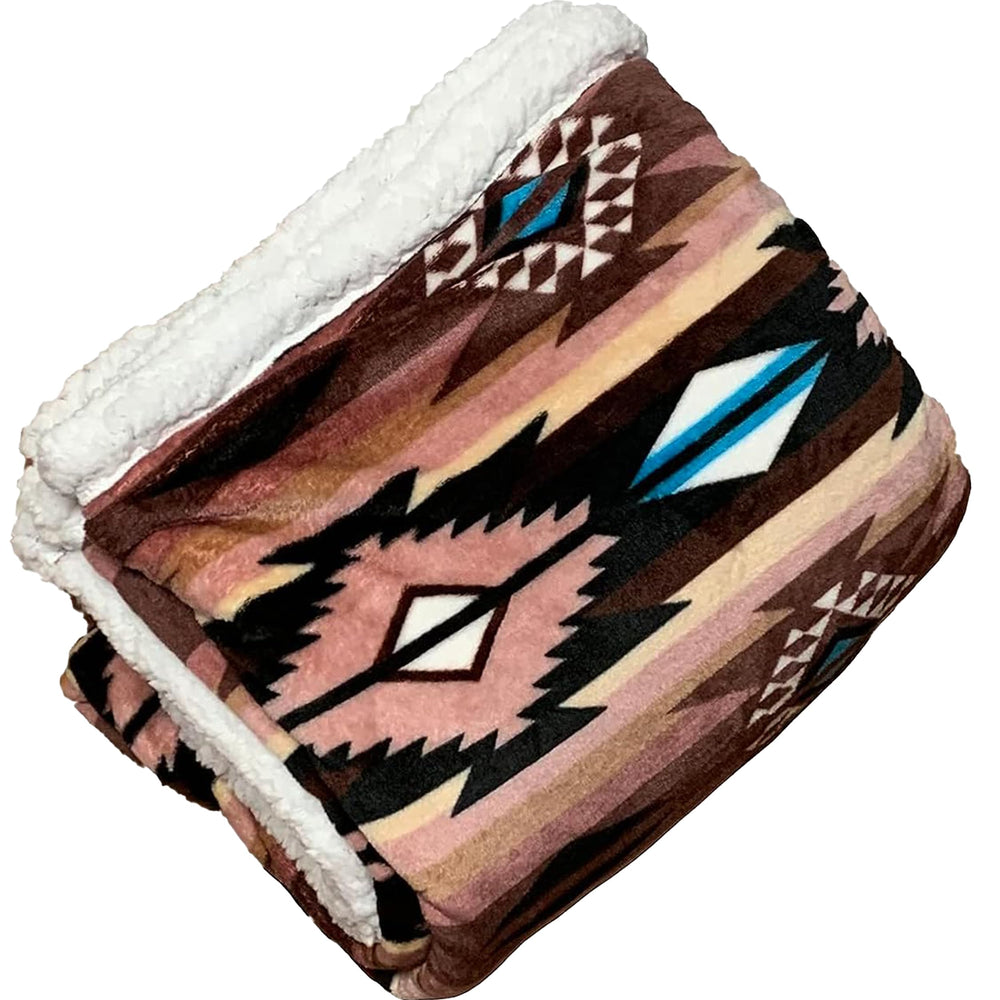 TrailCrest ultra-soft sherpa throw blanket folded on couch for cozy movie night warmth
