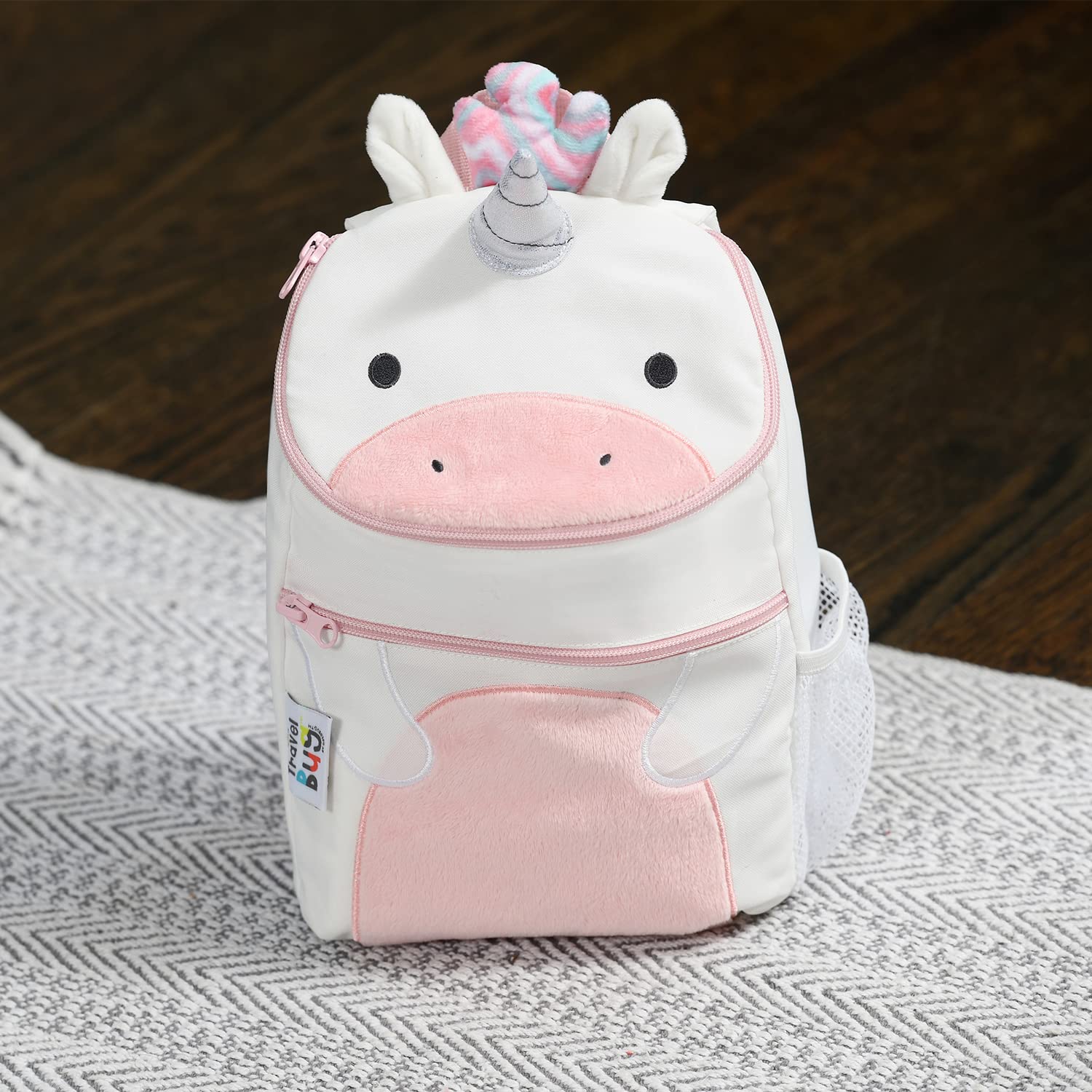 Travel Bug unicorn harness side view with wrist strap for added control.