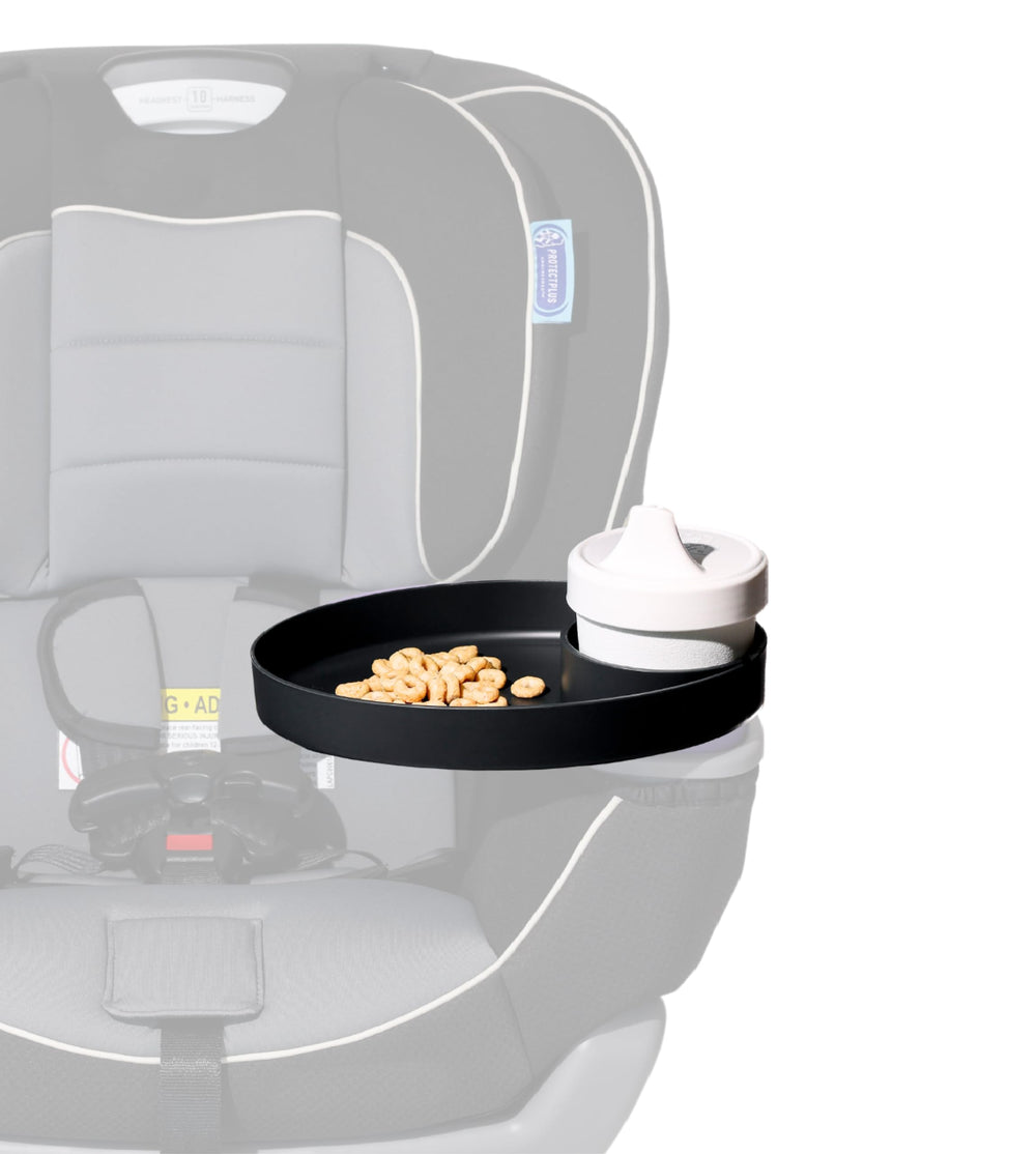 Travel Tray Oval Pirate Black in car seat demonstrates easy reach for snacks and cups.