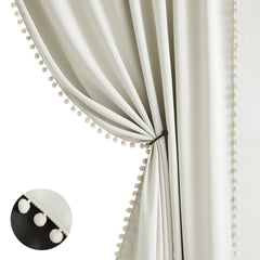 Treatmentex natural blackout curtains with ivory pom pom border for privacy.