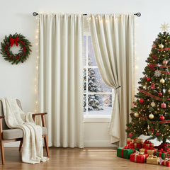 Treatmentex Pom Pom Curtains wide panel highlights ivory fabric and full drape effect.